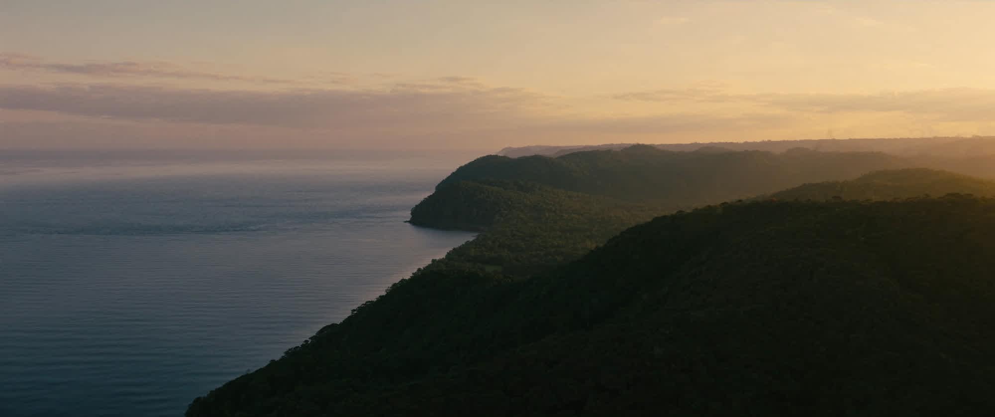 Osa Peninsula coastline where dense rainforest meets the calm Golfo Dulce