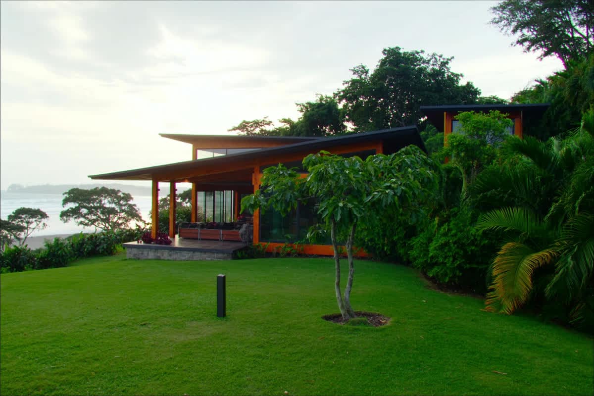Tropical timber home on a jungle ridge overlooking the Golfo Dulce